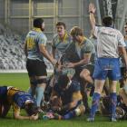 Shell-shocked Taieri players pick themselves up as University begin the celebrations after a last...