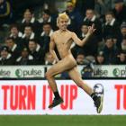 A streaker runs onto the field during the Super Rugby Aotearoa match between the Highlanders and...