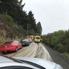 Emergency services are working to extract a man stuck in a vehicle down a bank off Leith Valley...