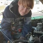 Mac Emeny (15) works under the bonnet of a vehicle at Camco Autos as part of the Central Otago...