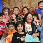 Alofa Lale tells traditional Samoan tales at Punavai O le Atamai preschool yesterday to (back,...