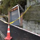 An Evans St garage has been cordoned off after it collapsed early yesterday morning. PHOTO:...