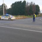 Police block the street at the beginning of Curran Rd. Photo:  Karen Pasco