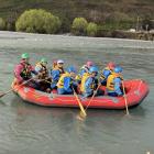 Fun in a raft . . . Kaiapoi High School Students navigate on their way down the Waimakariri River...