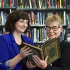 Otago Girls’ High School librarian Monique Patterson (left) and former pupil Margaret Cassie hold...