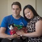 Dunedin couple Dillon Maydon and Amber Lim with their fashionable feline, tuxedo cat Brie. Photos...
