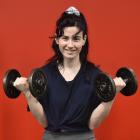New gym member Samantha Addington tests the dumbbells at SkyFit24 gym in Moray Pl. PHOTO: GREGOR...