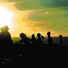 More than 200 people run down the Dunedin Airport runway for charity as the sun sets behind them...