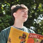 Former King’s High School pupil Cam Fraser holds a French textbook, one of the seven subjects for...