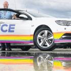 Celebrating diversity . . . Sergeant Don Munro with the new rainbow police car in Rangiora. PHOTO...