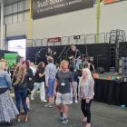 Craft beer enthusiasts enjoy the entertainment at the Hop’n’Vine beer, wine and food festival at...