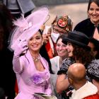 Katy Perry takes selfies with guests during the coronation of King Charles III and Queen Camilla...