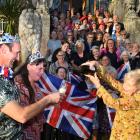 Larnach Castle owner Margaret Barker pours some bubbles for Liam and Jacqueline Sparrow during a...