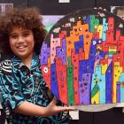 Thomas Matthews-Nielson (8) holds his art work during the St Joseph’s Cathedral School art...