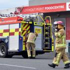 Firefighters outside to the Lookout Point Food Centre, on Riselaw Rd, this morning. PHOTO: PETER...