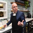 National Party leader Christopher Luxon tries a Southland delicacy at the Majestic Cafe in...