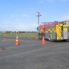 One fire truck attended the scene of a downed power line yesterday that ignited a small patch of...