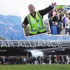 Passengers leave Air New Zealand flight NZ614, one of the flights disrupted at Queenstown Airport...