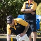 Kerrin Wheeler delivers his bowl as his father Colin watches during the North East Valley...