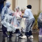 Cruise ship passengers brave the rain as they explore Port Chalmers. Photos: Stephen Jaquiery