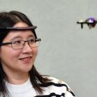 Dr Veronica Liesaputra shows off a drone controlled by a device that reads activity from the...