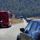 Vehicles pass campervans, buses and people at the roadside. PHOTO: STEPHEN JAQUIERY