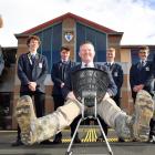 Mucking in . . . King’s High School rector Nick McIvor has his boots ready to support about 50 of...