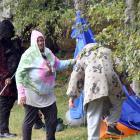 Dunedin Bedding Bank’s Janine Walker (pictured centre) helps two homeless men put up her last...