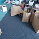 Cathy and her daughter packing up from their motel room to be shifted to different transitional...