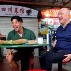 Prime Minister Christopher Luxon has a Singaporean street food breakfast with local social media...