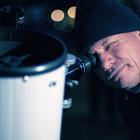 Dunedin astronomer Nick Simpson looks at star Alpha Crucis through a telescope at Naseby Domain...