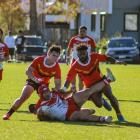 Halswell’s Cooper Te Hau and Jope Drala combine to tackle an Eastern player during Eastern’s 32...