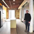 Property developer Russell Lund stands in one of the "five-star" social housing units in his...