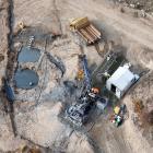 An aerial view of a drilling rig at the Rise and Shine deposit, atop the Rise and Shine ridge,...