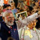 Indian Prime Minister Narendra Modi gestures as he arrives at Bharatiya Janata Party (BJP)...