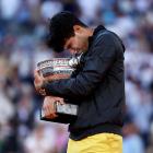 Carlos Alcaraz hugs the the Musketeers’ cup after winning the men's singles final in Paris on...