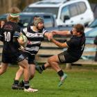 Crescent midfielder Ethan Edwards gets one over his opposite, Clinton’s Lucas Hopkins, during the...