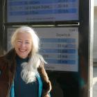 ORC transport committee chair Alexa Forbes in front of the new real-time bus screens in Frankton....