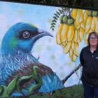 Cr Michelle Kennedy stands beside the new mural at Whisky Gully, Tapanui. PHOTO: NICK BROOK