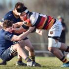 Dunedin lock Jamie Mowat (left) grabs Zingari-Richmond No 8, Tofatuimoana Solia, at Montecillo on...