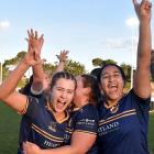 Dunedin players (from left) Grace Guyton-Voyce, Erin Adams and Amoe Wharehinga celebrate their win.