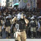 Military police make their way into the central square in Bolivia's capital La Paz as an...