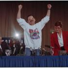 Terry Anderson raises his arms in triumph at a press conference. Anderson was just released by a...