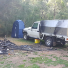 The pair's campsite was found burnt, but Mr Hill's car was still there. Photo: Supplied