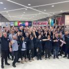 Kmart staff welcome customers with open arms at the new Dunedin store this morning. Photo:...