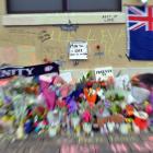 A small sign amidst the memorial messages and flowers at the bus hub, in memory of Enere McLaren...