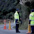 Police have set up checkpoints around Marokopa as they step up the search for Tom Phillips and...