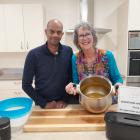 Reach Church senior pastor Brendon Perumal supports cook Annie Beattie at the most recent...