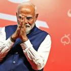 India’s Prime Minister Narendra Modi gestures at the Bharatiya Janata Party (BJP) headquarters to...