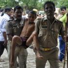 A boy, who was injured in a crowd crush at a religious gathering, is taken to a hospital for a...